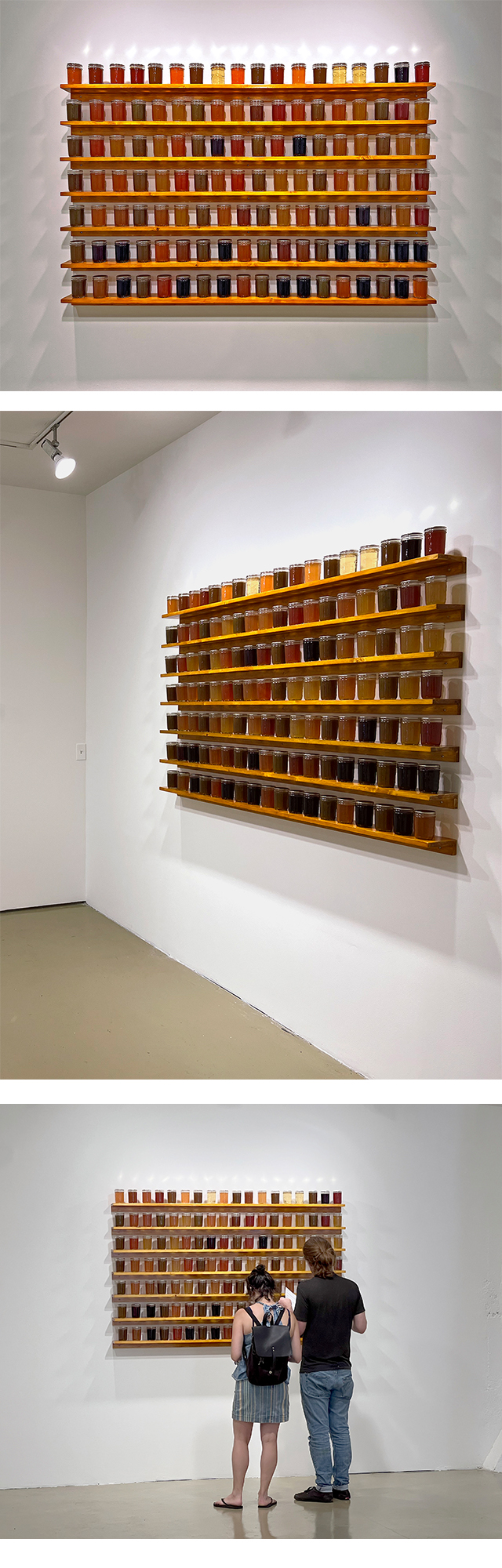 installation of 1/2 pint jars of jam on shelving, colors are variable, but shades of orange, yellow, green and purple